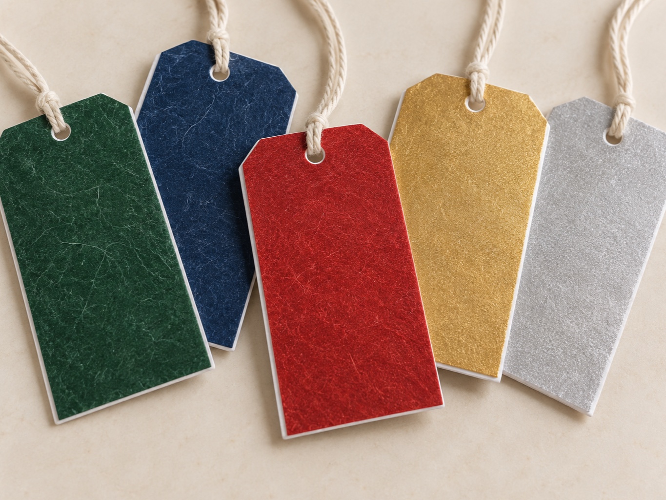 Blank flashspun HDPE hang tags printed in green, blue, red, gold and silver